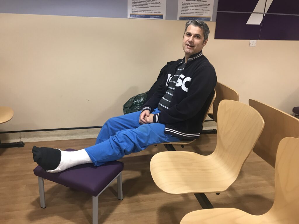 Claudio waiting with his foot on cast